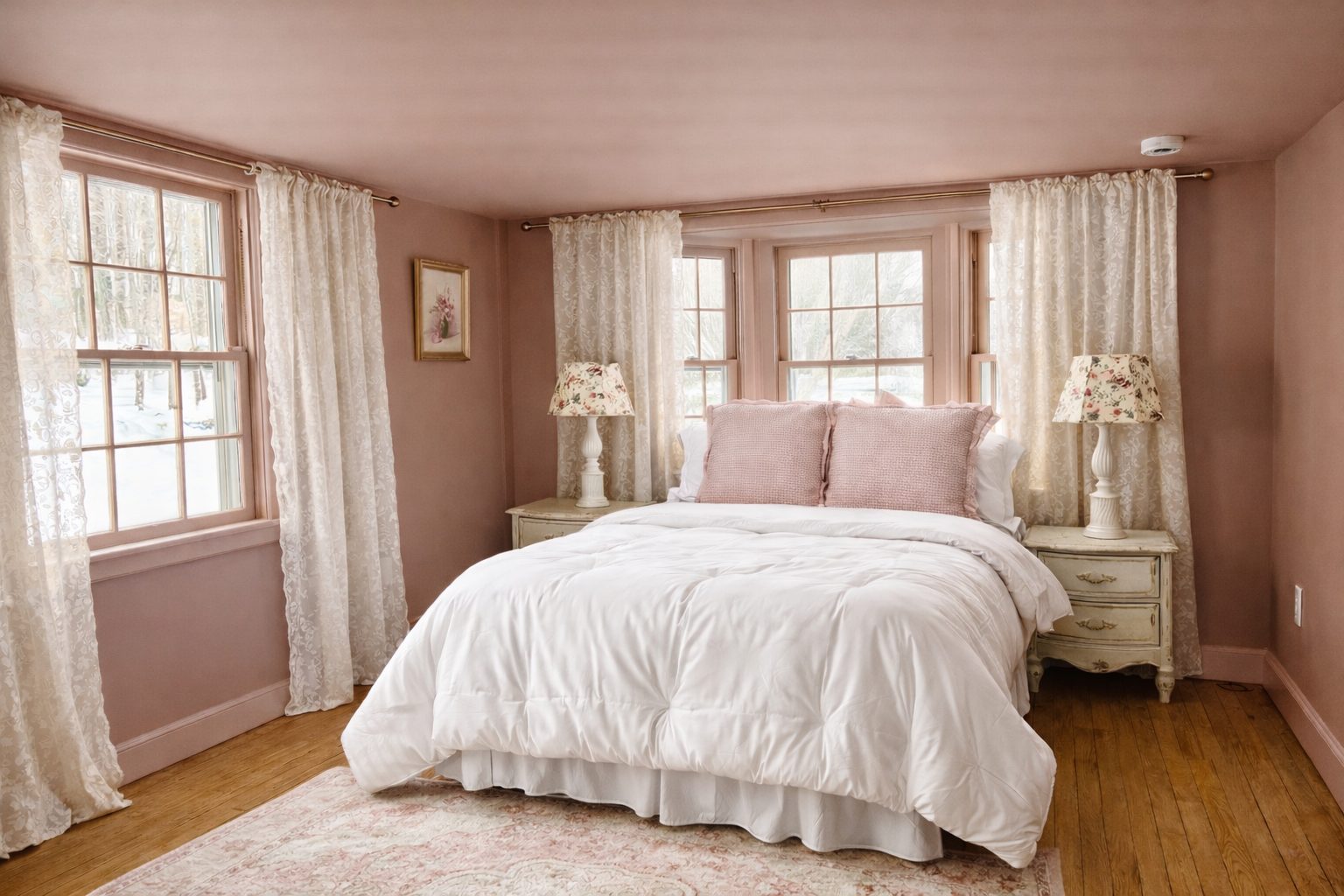 First floor queen bedroom in soft blush with bay windows