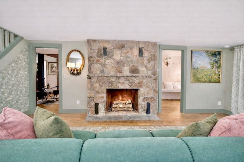 Living room with stone fireplace