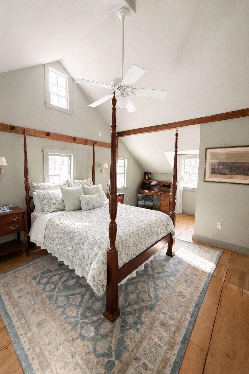 Primary queen bedroom with vaulted ceiling and antique writing desk in the Pawling NY vacation rental